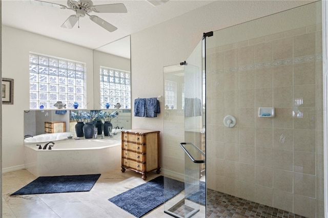 bathroom featuring plus walk in shower and ceiling fan