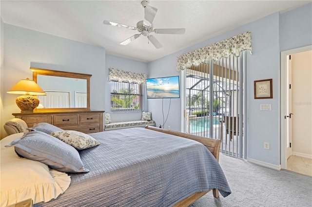 bedroom featuring access to exterior, carpet, multiple windows, and ceiling fan