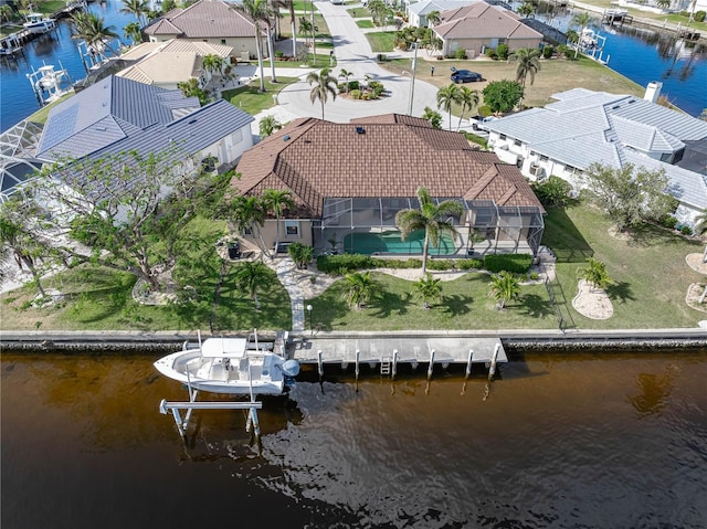 birds eye view of property with a water view