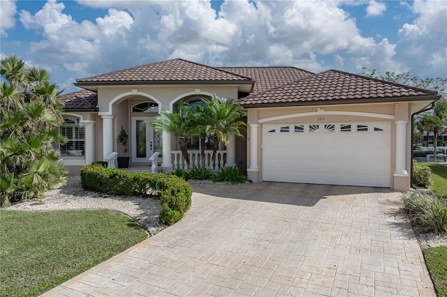 mediterranean / spanish house with a garage