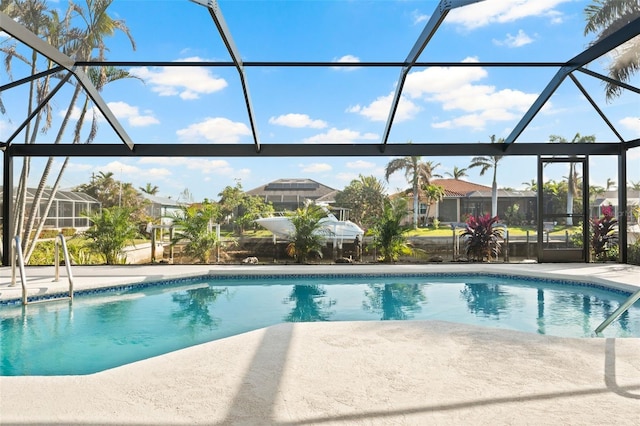 view of pool featuring a lanai and a patio