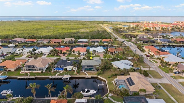 birds eye view of property with a water view