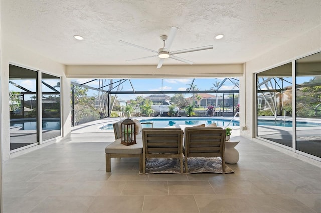 sunroom / solarium with ceiling fan