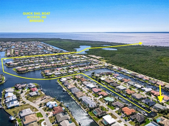 bird's eye view with a water view and a residential view