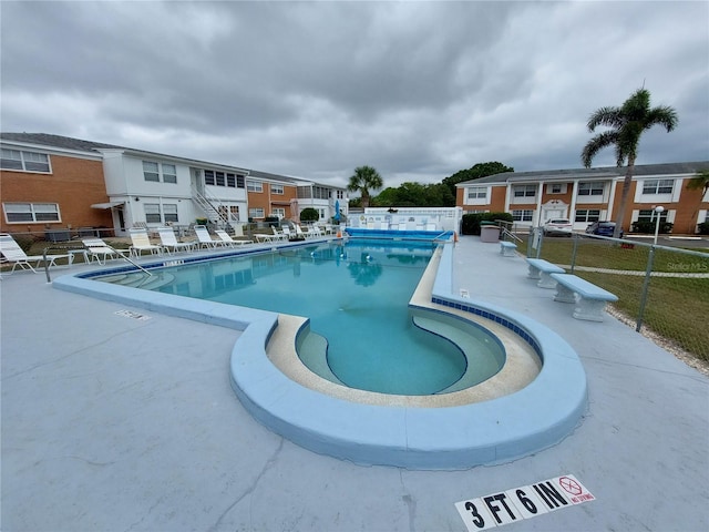 view of pool featuring a patio area