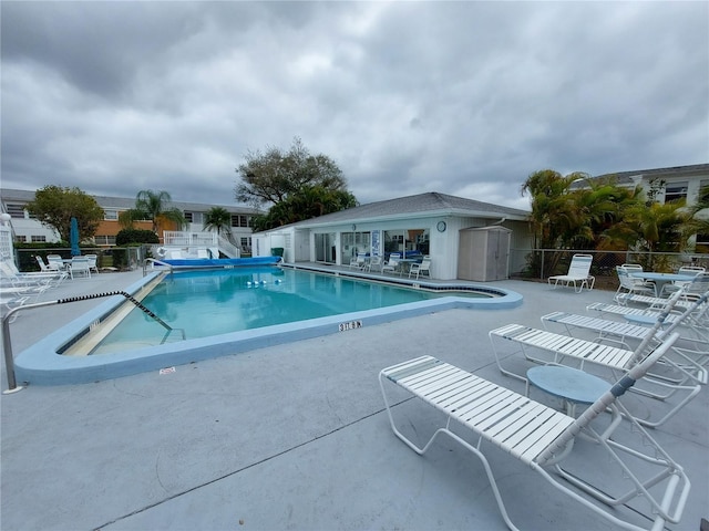 view of swimming pool with a patio