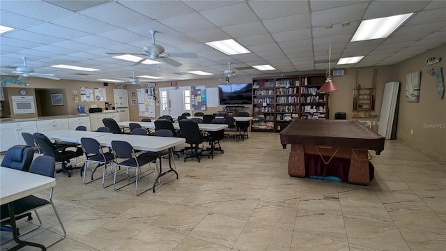 dining area featuring a paneled ceiling and ceiling fan