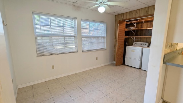 clothes washing area with ceiling fan, light tile patterned floors, and separate washer and dryer