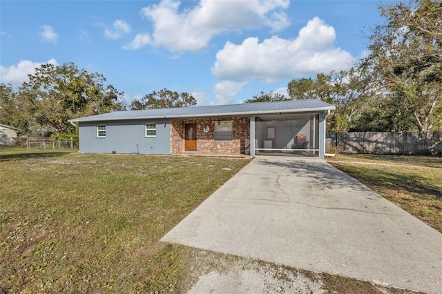 ranch-style home with a front lawn and a sunroom