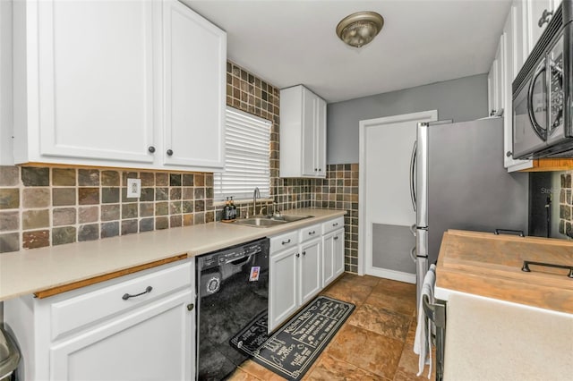 kitchen featuring black appliances, decorative backsplash, white cabinetry, and sink