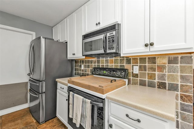 kitchen with white cabinets, decorative backsplash, and stainless steel appliances