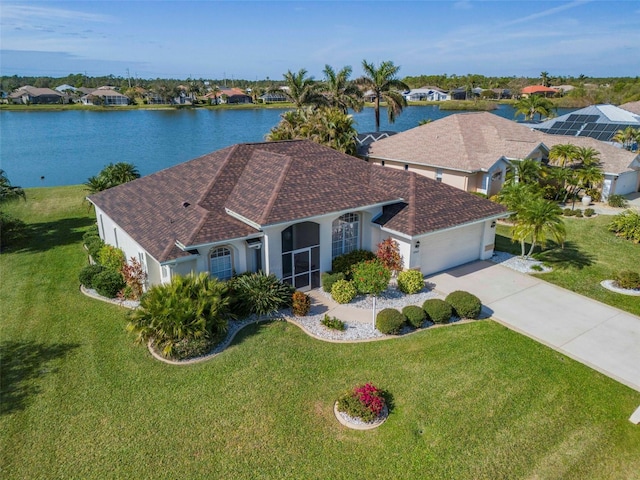 birds eye view of property with a water view