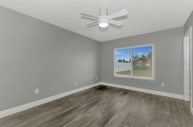 empty room with ceiling fan and hardwood / wood-style floors