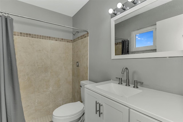 bathroom with vanity, curtained shower, and toilet