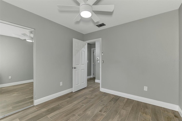 unfurnished room with ceiling fan