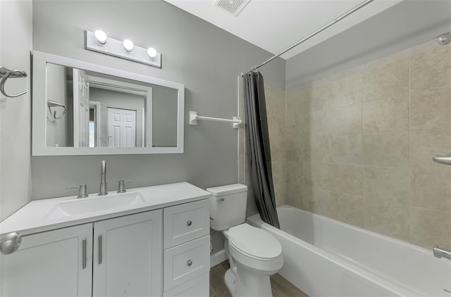 full bathroom featuring vanity, toilet, and shower / bath combo with shower curtain