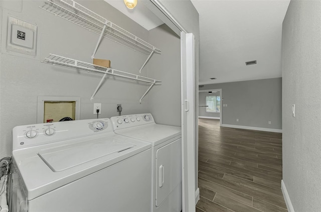 clothes washing area with washing machine and clothes dryer