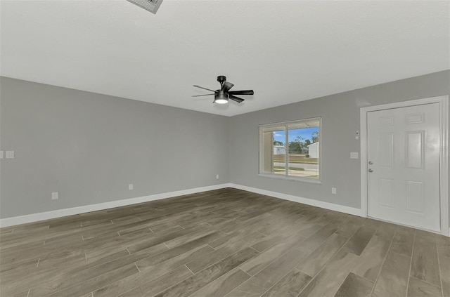 interior space featuring ceiling fan