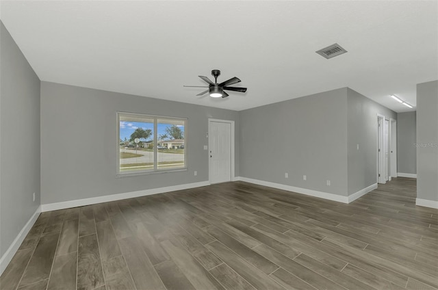 unfurnished living room featuring hardwood / wood-style flooring and ceiling fan