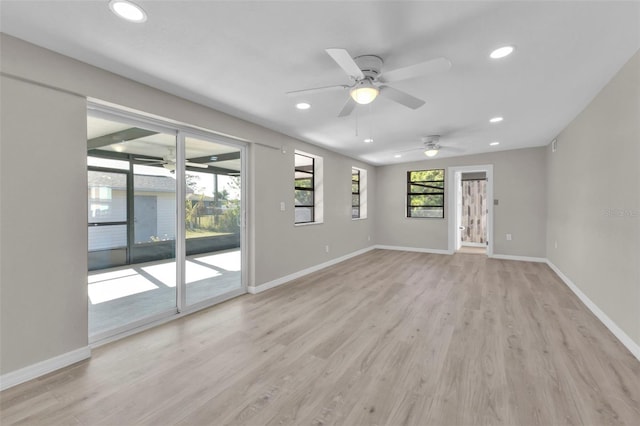 unfurnished room with ceiling fan and light hardwood / wood-style floors