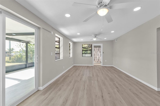 unfurnished room with light wood-type flooring