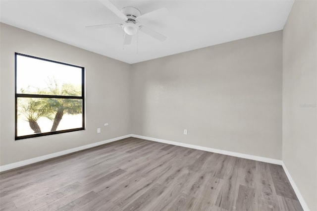 spare room featuring ceiling fan and light wood-type flooring