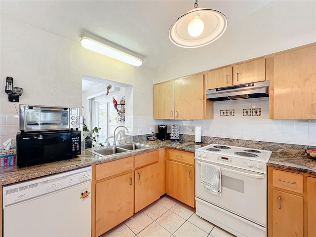 kitchen featuring decorative backsplash, sink, and white appliances