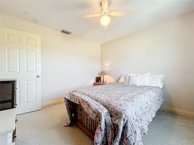 bedroom with light colored carpet and ceiling fan