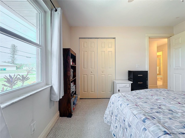 carpeted bedroom with a closet