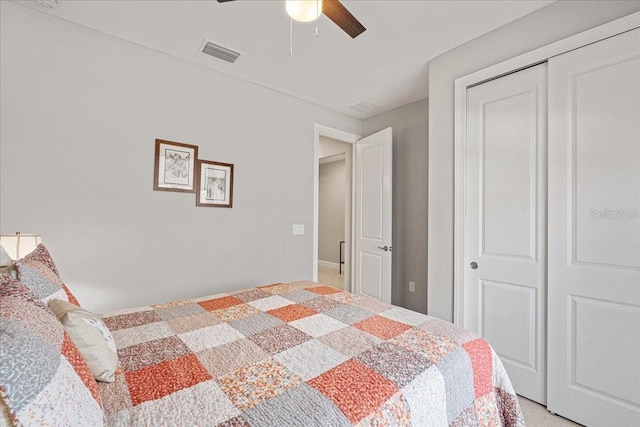 bedroom featuring ceiling fan and a closet