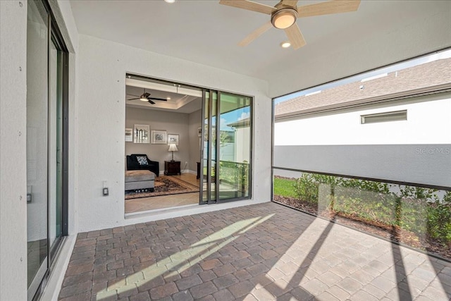 unfurnished sunroom featuring a tray ceiling