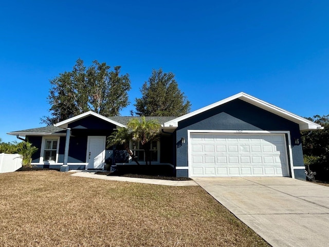 ranch-style house with a front lawn, covered porch, and a garage