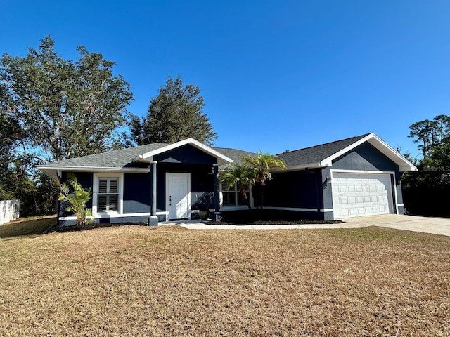 ranch-style home featuring a garage and a front lawn