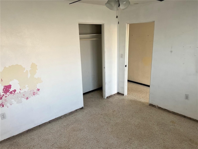 unfurnished bedroom featuring a closet and ceiling fan