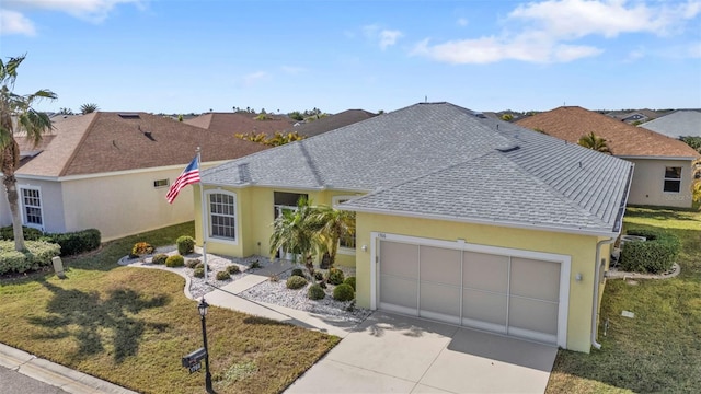 ranch-style house with a garage and a front lawn