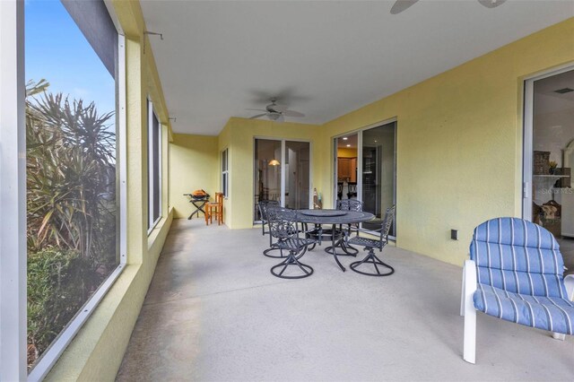 sunroom with ceiling fan