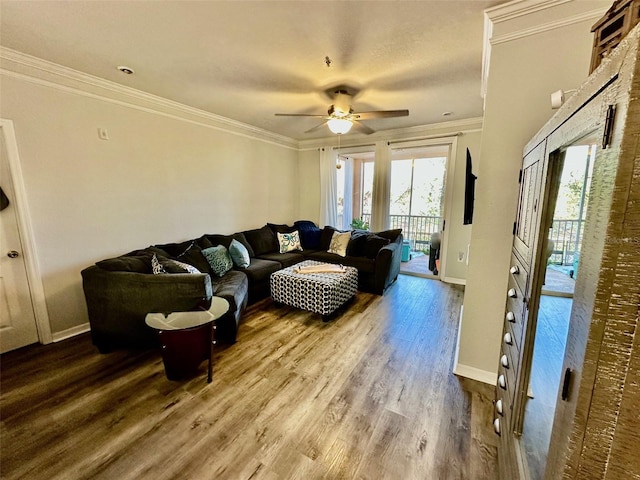 living room with crown molding, hardwood / wood-style floors, and ceiling fan