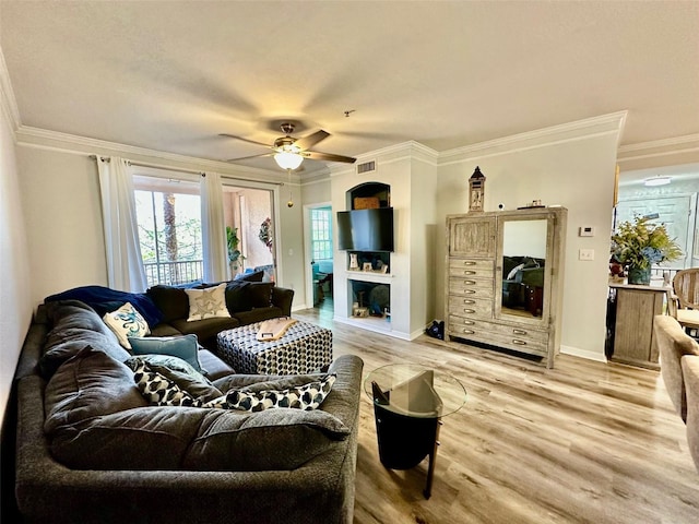 living room with light hardwood / wood-style flooring, ceiling fan, and ornamental molding