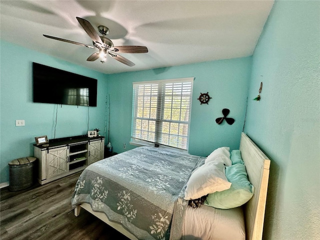 bedroom with ceiling fan and wood-type flooring