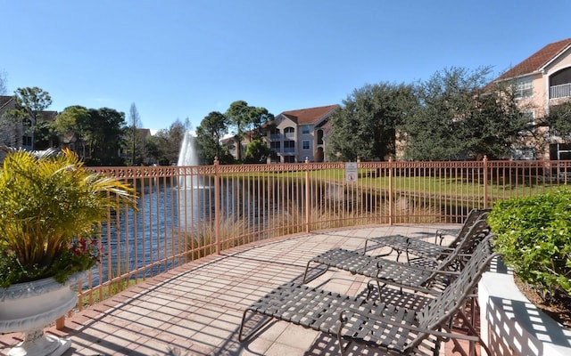 view of patio featuring a water view