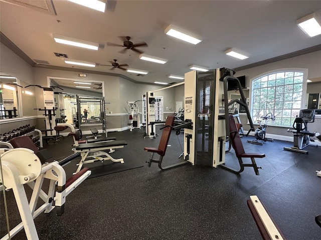 gym featuring ceiling fan and crown molding