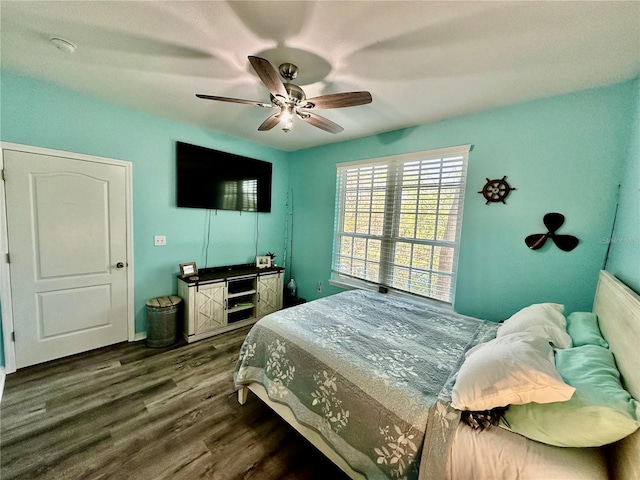 bedroom featuring dark wood-style floors and ceiling fan