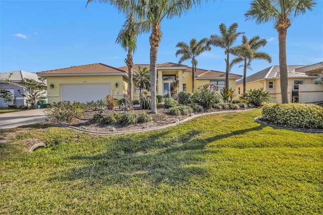 view of front of home with a garage and a front lawn