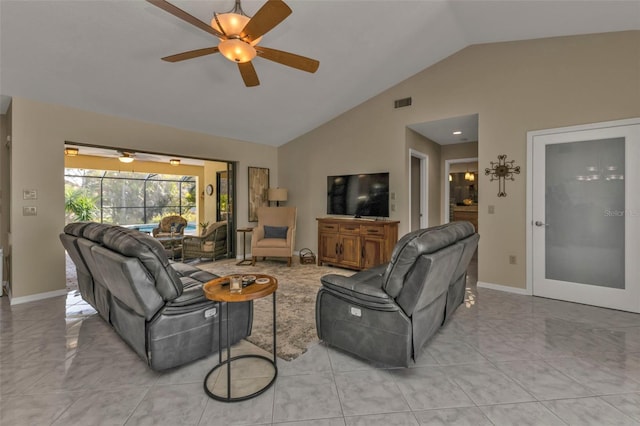 living room with ceiling fan and vaulted ceiling