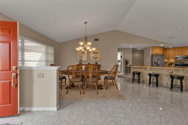 dining space featuring light tile patterned flooring, lofted ceiling, and a chandelier