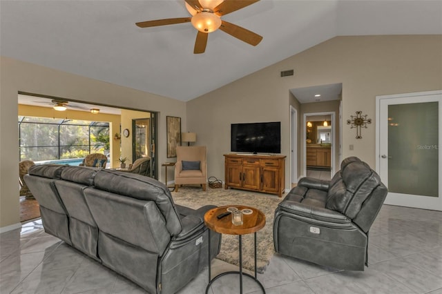 living room featuring ceiling fan and lofted ceiling