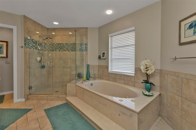 bathroom featuring tile patterned flooring and independent shower and bath