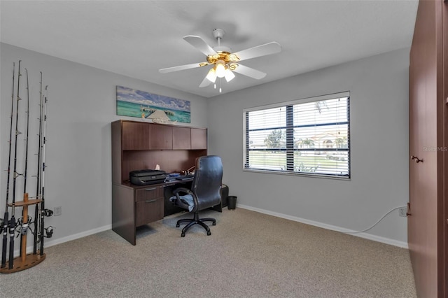 home office featuring light carpet and ceiling fan