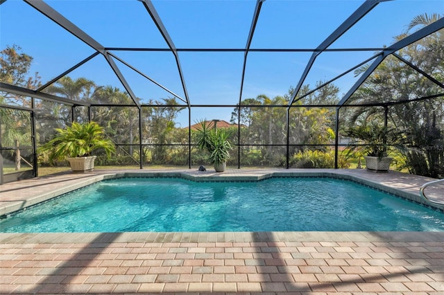 view of pool featuring a lanai and a patio