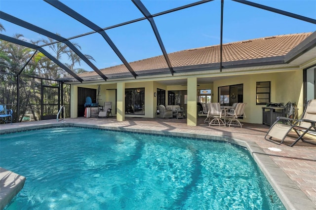 view of swimming pool featuring a lanai, outdoor lounge area, and a patio